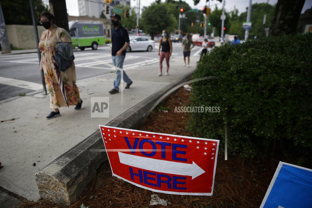 Brynn Anderson People wait in a line to vote in the Georgia's primary election at Park Tavern on Tuesday, June 9, 2020, in Atlanta. (AP Photo/Brynn Anderson)