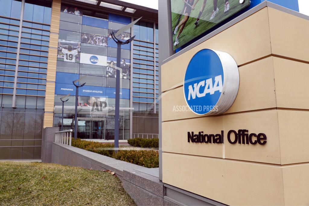 FILE - This March 12, 2020, file photo, shows the national office of the NCAA in Indianapolis. The NCAA will distribute $225 million to its Division I members in June, $375 million less than had been budgeted this year because the coronavirus outbreak forced the cancellation of the men's basketball tournament. (AP Photo/Michael Conroy, File)