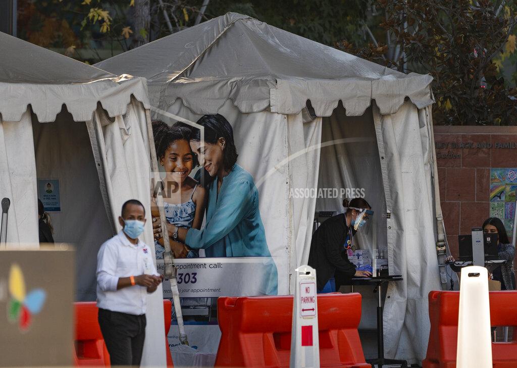 Damian Dovarganes FILE - In this Dec. 18, 2020, file photo, medical tents for vaccinations are set outside the Children's Hospital Los Angeles. California became the first state to record 2 million confirmed coronavirus cases, reaching the milestone on Christmas Eve as close to the entire state was under a strict stay-at-home order and hospitals were flooded with the largest crush of cases since the pandemic began. (AP Photo/Damian Dovarganes, File)