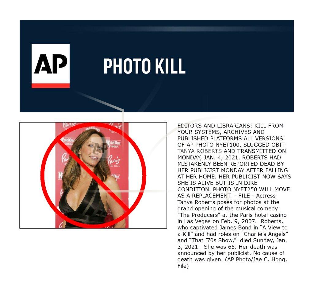 Jae C. Hong FILE - Actress Tanya Roberts poses for photos at the grand opening of the musical comedy "The Producers" at the Paris hotel-casino in Las Vegas on Feb. 9, 2007. Roberts, who captivated James Bond in “A View to a Kill” and had roles on “Charlie’s Angels” and “That ’70s Show,” died Sunday, Jan. 3, 2021. She was 65. Her death was announced by her publicist. No cause of death was given. (AP Photo/Jae C. Hong, File)