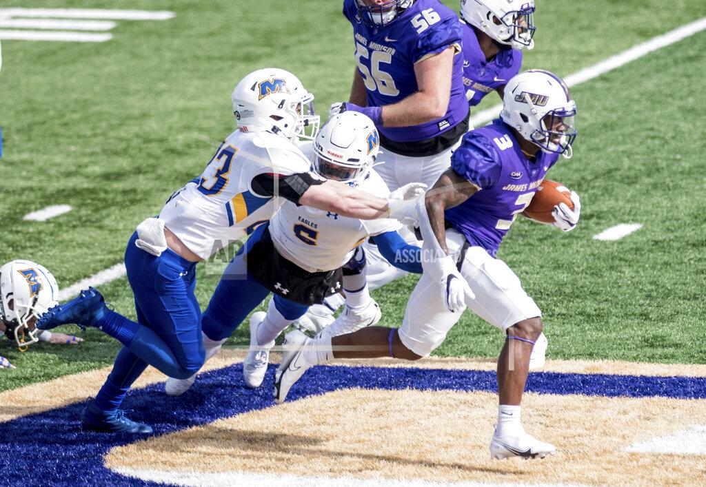 Daniel Lin FILE - James Madison running back Solomon Vanhorse (3) breaks away from Morehead State defensive back Cooper Krezek (23) during the first half of an NCAA college football game in Harrisonburg, Va., in this Saturday, Feb. 20, 2021, file photo. James Madison remains solidly atop the STATS Perform FCS Top 25, but the Dukes could go into the playoffs on April 24 having played once in six weeks.(Daniel Lin/Daily News-Record via AP, File)