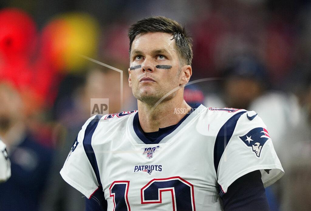 David J. Phillip New England Patriots quarterback Tom Brady (12) stands on the sidelines during the first half of an NFL football game against the Houston Texans Sunday, Dec. 1, 2019, in Houston. (AP Photo/David J. Phillip)