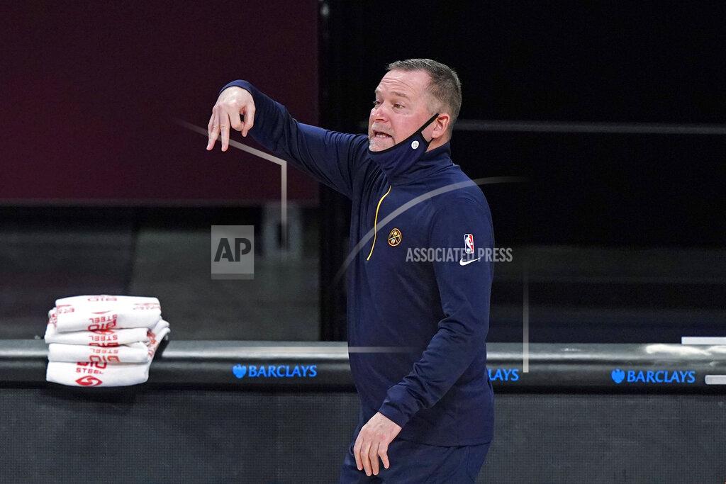 Kathy Willens Denver Nuggets coach Michael Malone gestures during the second quarter of the team's NBA basketball game against the Brooklyn Nets, Tuesday, Jan. 12, 2021, in New York. (AP Photo/Kathy Willens)