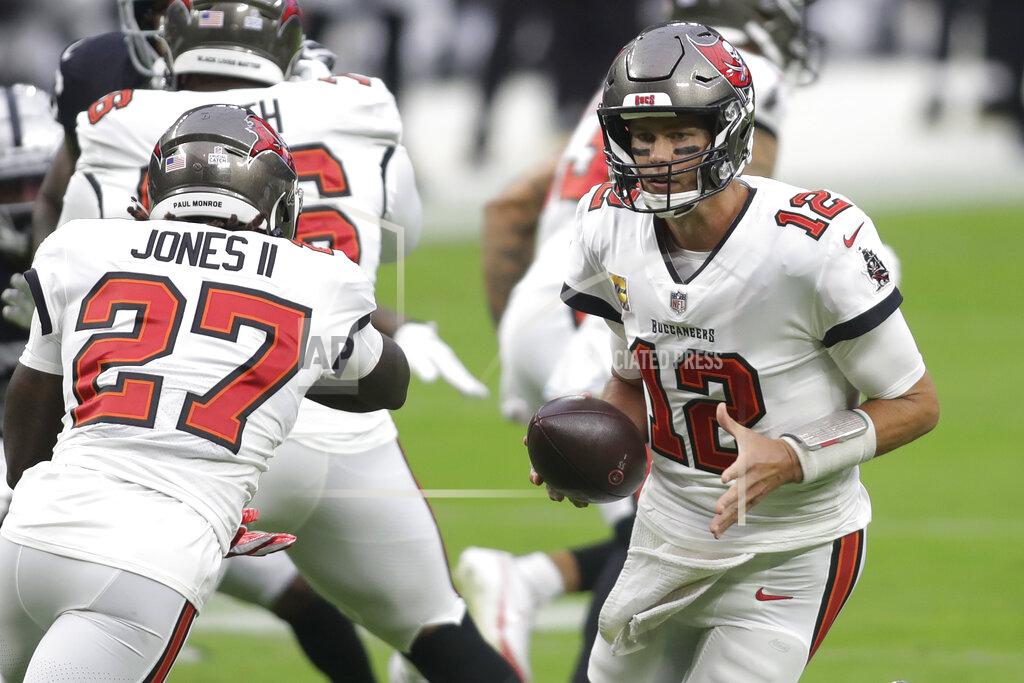 Isaac Brekken Tampa Bay Buccaneers quarterback Tom Brady (12) drops back before throwing against the Las Vegas Raiders during the first half of an NFL football game, Sunday, Oct. 25, 2020, in Las Vegas. (AP Photo/Isaac Brekken)