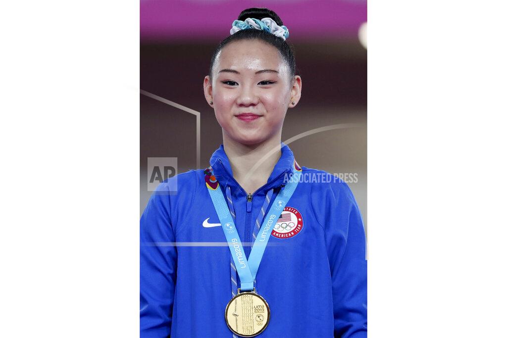 FILE - Kara Eaker of the United States stands on the podium with her gold medal after winning on the beam in the women's artistic gymnastics apparatus final at the Pan American Games in Lima, Peru, in this Wednesday, July 31, 2019, file photo. Kara Eaker, an alternate on the United States women's gymnastics team, has tested positive for COVID-19 in an Olympic training camp in Japan. Al Fong, the personal coach for both Eaker and fellow Olympic alternate Leanne Wong, confirmed the positive test in an email to The Associated Press on Monday, July 19, 2021. (AP Photo/Fernando Vergara, File)
