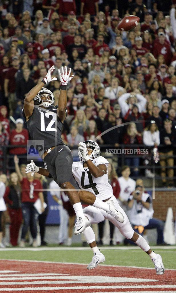 Young Kwak Washington State wide receiver Dezmon Patmon (12) catches a pass for a touchdown against Oregon cornerback Thomas Graham Jr. (4) during the second half of an NCAA college football game in Pullman, Wash., Saturday, Oct. 20, 2018. Washington State won 34-20. (AP Photo/Young Kwak)