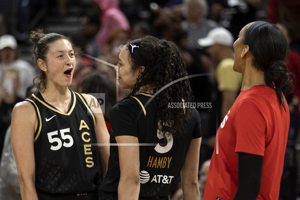 Ellen Schmidt Las Vegas Aces forward Theresa Plaisance (55), forward Dearica Hamby (5) and forward A'ja Wilson, right, celebrate after winning a WNBA basketball game against the Phoenix Mercury, Saturday, May 21, 2022, in Las Vegas. (AP Photo/Ellen Schmidt)