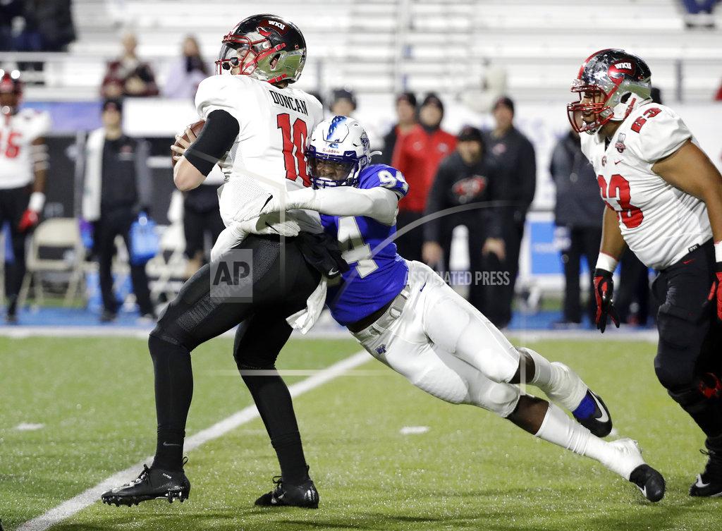 Mark Humphrey Middle Tennessee defensive end Tyshun Render (94) sacks Western Kentucky quarterback Steven Duncan (10) for a 7-yard loss during the second half of an NCAA college football game Friday, Nov. 2, 2018, in Murfreesboro, Tenn. Middle Tennessee won 29-10. (AP Photo/Mark Humphrey)