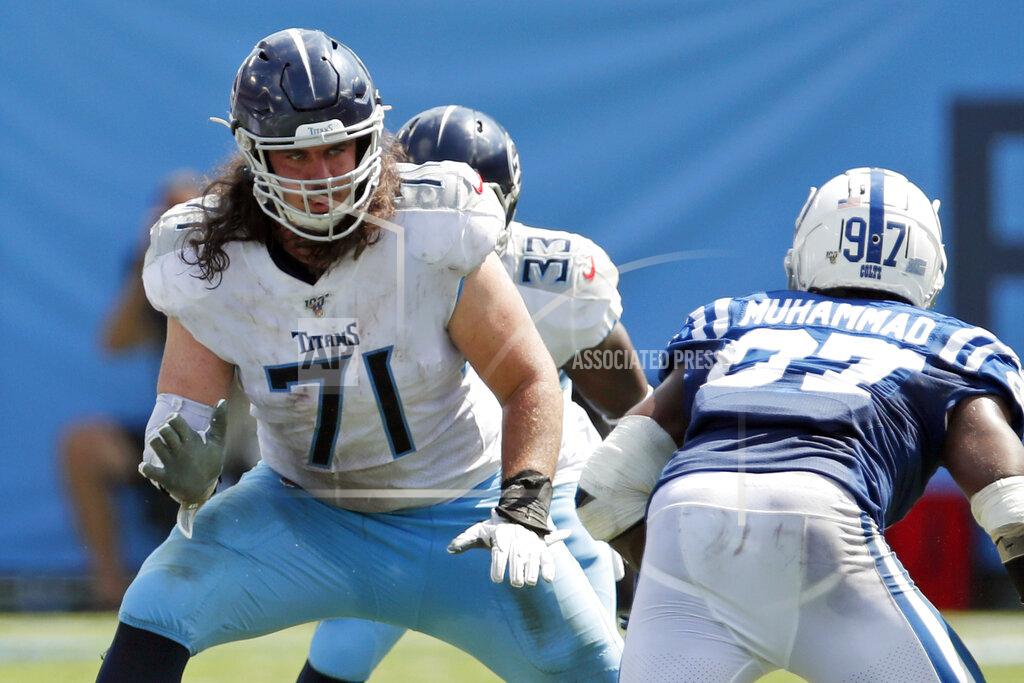 Jeff Haynes FILE - In this Sept. 15, 2019, file photo, Tennessee Titans offensive tackle Dennis Kelly (71) set to block against the Indianapolis Colts during an NFL football game in Nashville, Tenn. Kelly has been hunkered down with his family in the Indianapolis area since the birth of his third daughter a month ago. That makes dealing with the coronavirus a bit easier for Kelly, one of hundreds of NFL players who have self-isolated while the league sorts through what's next. (Jeff Haynes/AP Images for Panini, File)