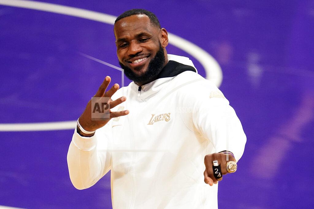 Marcio Jose Sanchez FILE - In this Tuesday, Dec. 22, 2020, file photo, Los Angeles Lakers forward LeBron James reacts after receiving his NBA championship ring before an NBA basketball game against the Los Angeles Clippers in Los Angeles. James was announced Saturday, Dec. 26, as the winner of The Associated Press’ Male Athlete of the Year award for a record-tying fourth time. (AP Photo/Marcio Jose Sanchez, File)