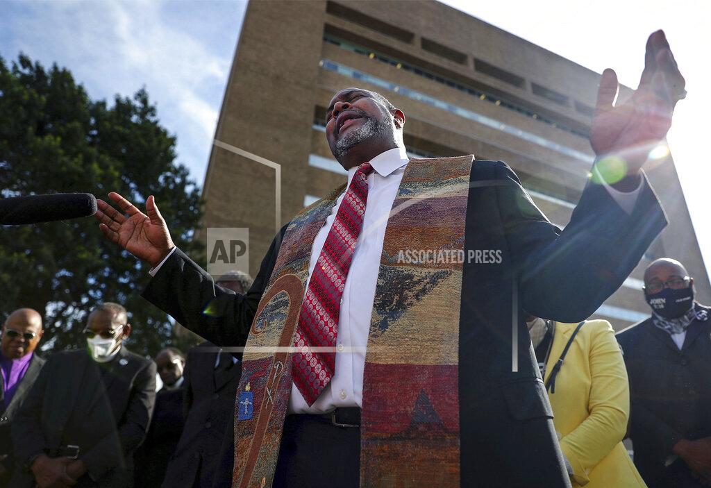 Patrick Lantrip Pastor and University of Memphis professor Andre E. Johnson leads a prayer vigil for Pervis Payne outside of the Shelby County Criminal Justice Center on Friday, June 4, 2021 in Memphis. A hearing is scheduled Friday in the case of Payne, a Tennessee death row inmate who has long maintained his innocence and whose lawyers filed a petition saying he is intellectually disabled and should not be executed. (Patrick Lantrip/Daily Memphian via AP)