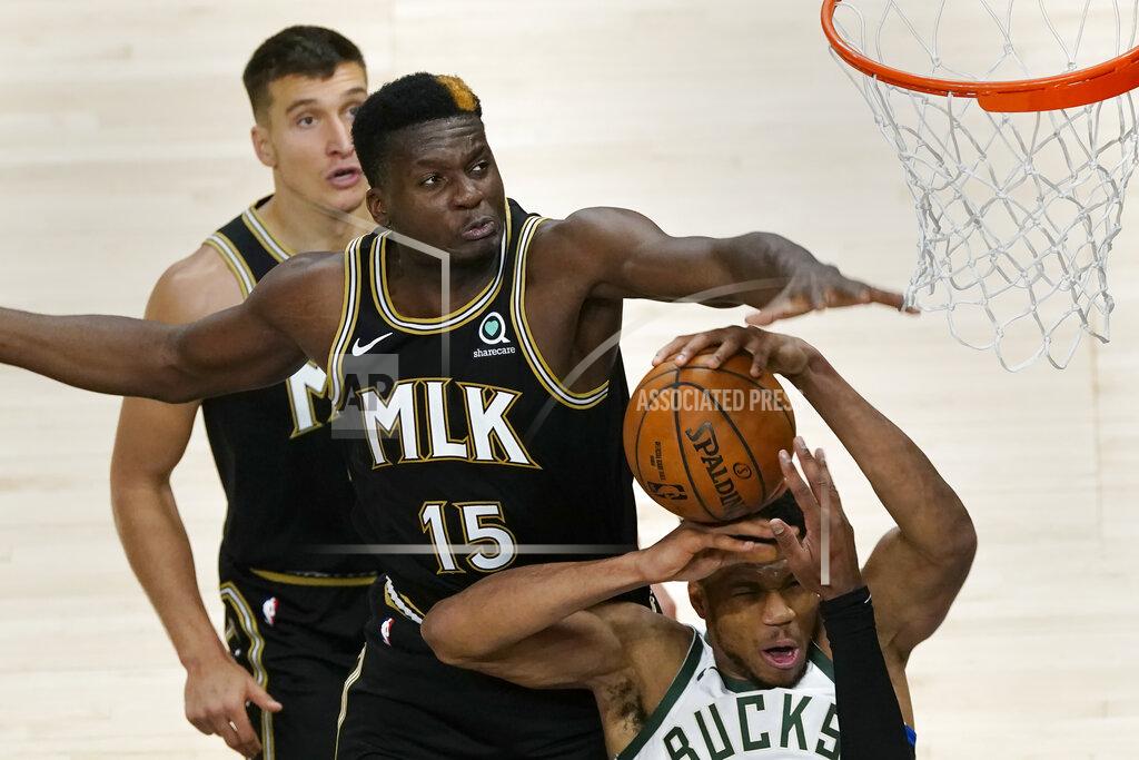 John Bazemore Milwaukee Bucks forward Giannis Antetokounmpo has his shot blocked by Atlanta Hawks center Clint Capela (15) during the second half of an NBA basketball game Thursday, April 15, 2021, in Atlanta. (AP Photo/John Bazemore)