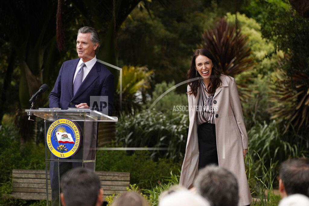 Eric Risberg California Gov. Gavin Newsom and New Zealand Prime Minister Jacinda Ardern prepare to take questions after an event at the San Francisco Botanical Garden in San Francisco, Friday, May 27, 2022. Gov. Newsom met with Ardern in Golden Gate Park "to establish a new international partnership tackling climate change." (AP Photo/Eric Risberg)