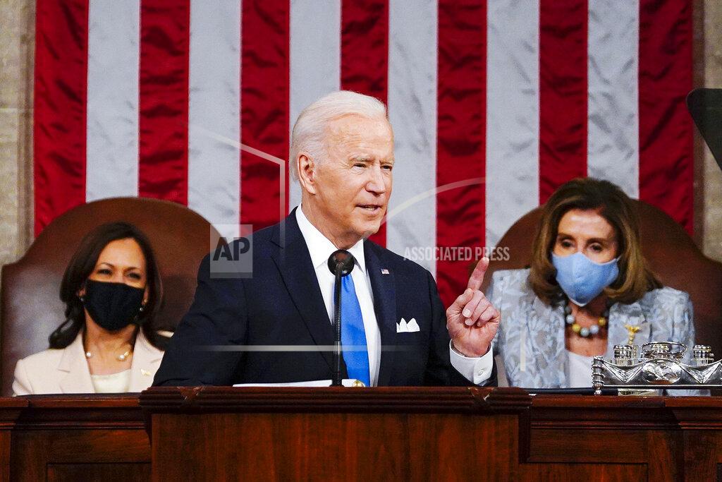 Melina Mara FILE - In this April 28, 2021, file photo President Joe Biden addresses a joint session of Congress in the House Chamber at the U.S. Capitol in Washington, as Vice President Kamala Harris, left, and House Speaker Nancy Pelosi of Calif., look on. Biden has moved into a new phase of his presidency, having already begun to face a historic series of crises and largely dedicating his first 100 days to steady a nation reeling from the COVID-19 pandemic that has killed nearly 570,000 Americans and devastated its economy. (Melina Mara/The Washington Post via AP, Pool)