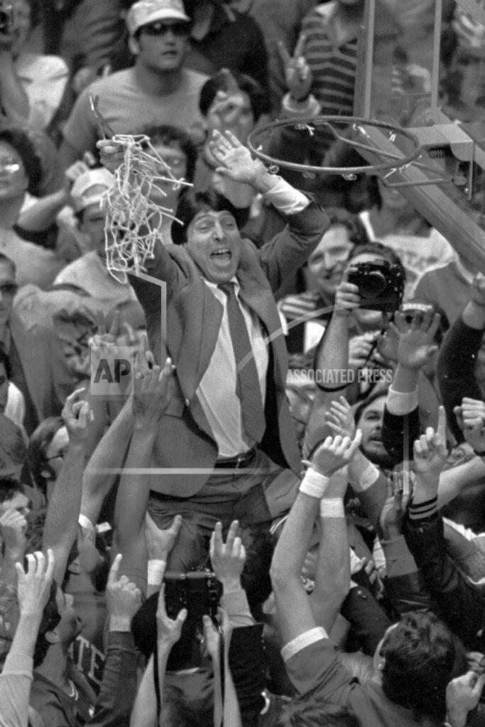Leonard Ignelzi FILE - In this April 4, 1983 file photo, North Carolina State coach Jim Valvano holds the net aloft after his team defeated Houston 54-52 for the national championship at the Final Four NCAA college basketball tournament in Albuquerque, N.M. (AP Photo/Leonard Ignelzi, File)