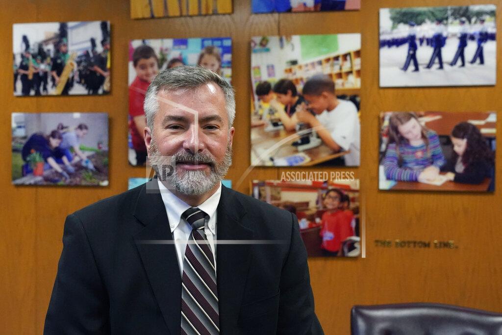 Eric Gay Superintendent Brian Woods, of Northside Independent School District, among the largest districts in Texas poses for a photo at his office, Monday, Feb. 8, 2021, in San Antonio. After seeing two academic years thrown off course by the pandemic, school leaders around the country are planning for the possibility of more distance learning next fall at the start of yet another school year. (AP Photo/Eric Gay)