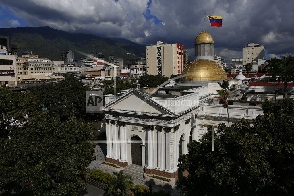 FILE - In this Jan. 6, 2020 file photo, the National Assembly stands in Caracas, Venezuela. Opposition lawmakers in Venezuela quietly agreed on the second week of April 2020, to pay themselves a $5,000 a month when they approved special $100 bonuses for doctors and nurses battling the coronavirus, a large payout for a nation where most workers are scraping by on couple of dollars a month, according to people involved in the process. (AP Photo/Andrea Hernandez Briceño, File)