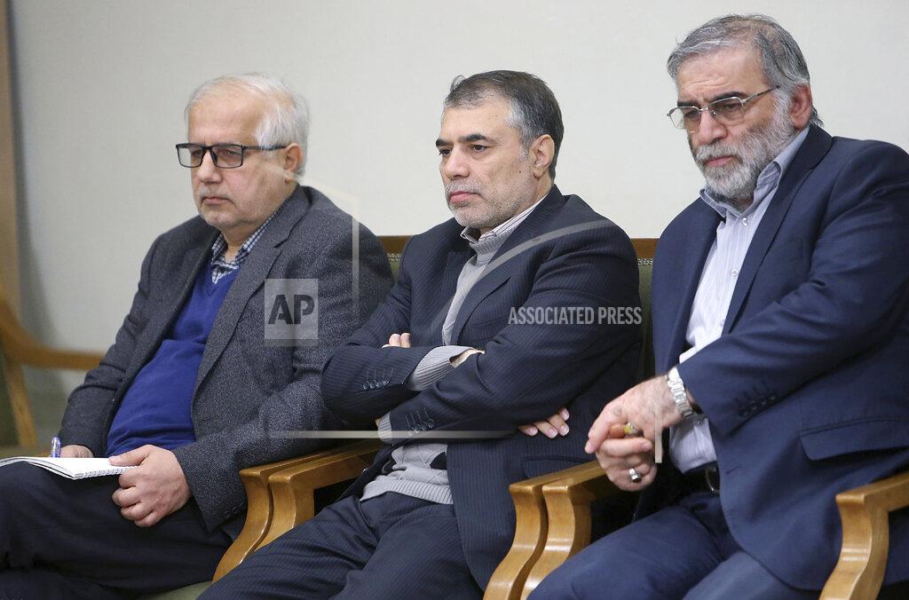 Uncredited In this picture released by the official website of the office of the Iranian supreme leader, Mohsen Fakhrizadeh, right, sits in a meeting with Supreme Leader Ayatollah Ali Khamenei in Tehran, Iran, Jan. 23, 2019. Fakhrizadeh, an Iranian scientist that Israel alleged led the Islamic Republic's military nuclear program until its disbanding in the early 2000s was killed in a targeted attack that saw gunmen use explosives and machine gun fire Friday Nov. 27, 2020, state television said. Two others are unidentified. (Office of the Iranian Supreme Leader via AP)