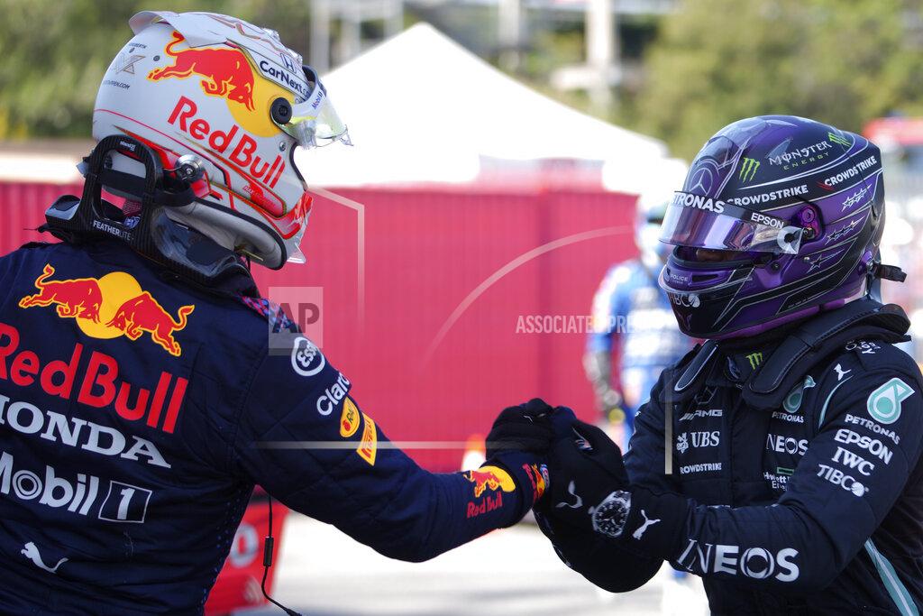 Emilio Morenatti Mercedes driver Lewis Hamilton of Britain, right, shakes hands with Red Bull driver Max Verstappen of the Netherlands after clocking the fastest time in the qualifying for the Spanish Formula One Grand Prix at the Barcelona Catalunya racetrack in Montmelo, just outside Barcelona, Spain, Saturday, May 8, 2021. The Spanish Grand Prix will be held on Sunday. Verstappen clocked the second fastest time. (AP Photo/Emilio Morenatti, Pool)