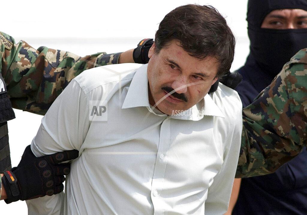 Eduardo Verdugo FILE - In this Feb. 22, 2014 file photo, Joaquin "El Chapo" Guzman, the head of Mexico's Sinaloa Cartel, is escorted to a helicopter in Mexico City following his capture in the beach resort town of Mazatlan, Mexico. The Mexican drug kingpin, who was convicted in a New York federal court in February 2019 on multiple conspiracy counts in an epic drug-trafficking case, was sentenced to life behind bars in a U.S. prison. (AP Photo/Eduardo Verdugo, File)
