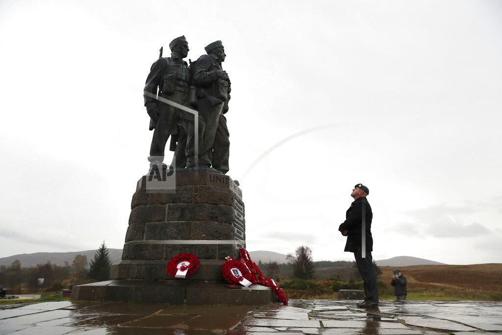 Andrew Milligan A small number of serving and former Royal Marine Commandos gather, at the Commando Memorial for the annual Remembrance Sunday ceremony, at Spean Bridge, near Fort William, Scotland, Sunday, Nov. 8, 2020. (Andrew Milligan/PA via AP)