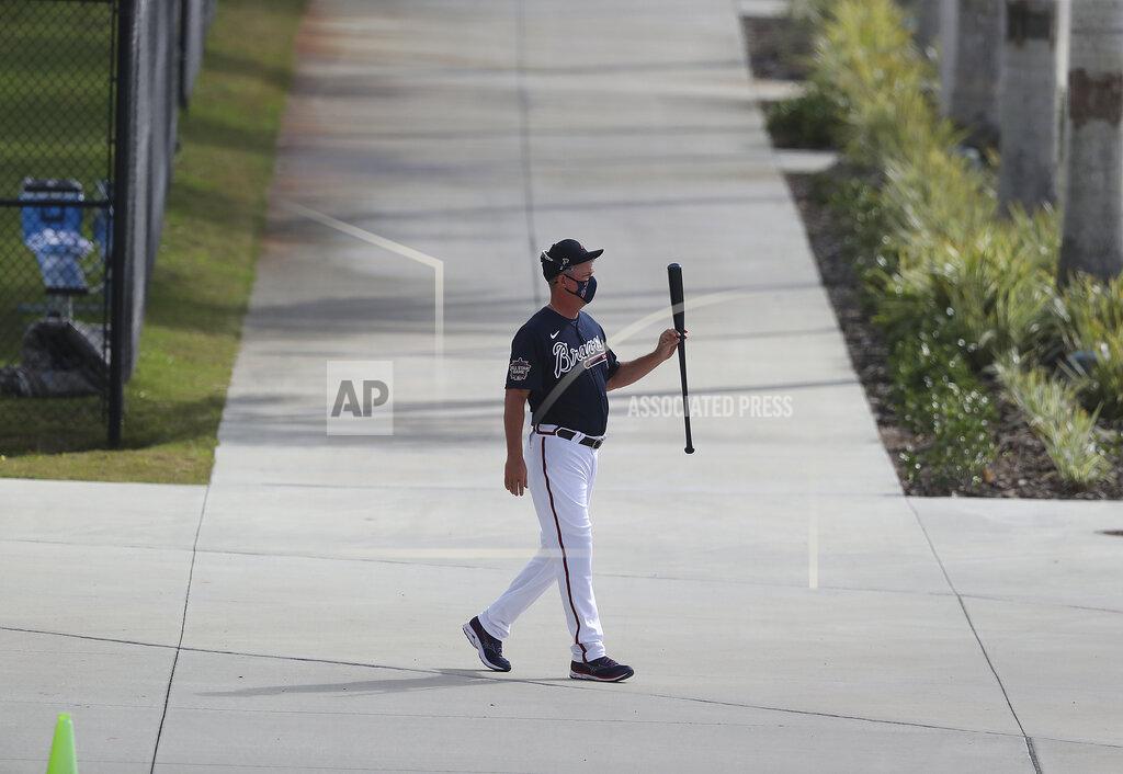 Curtis Compton Atlanta Braves Hall of Famer Chipper Jones leaves the batting cages twirling his bat after a morning session of batting practice during baseball spring training, Wednesday, Feb. 24, 2021, in North Port, Fla. (Curtis Compton/Atlanta Journal-Constitution via AP)