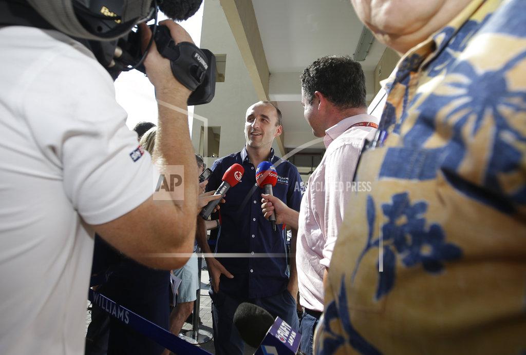 Luca Bruno Driver Robert Kubica answers to reporters at the Yas Marina racetrack in Abu Dhabi, United Arab Emirates, Thursday, Nov. 22, 2018. The Emirates Formula One Grand Prix will take place on Sunday. Robert Kubica will make his return to Formula One next year with the Williams team.(AP Photo/Luca Bruno)