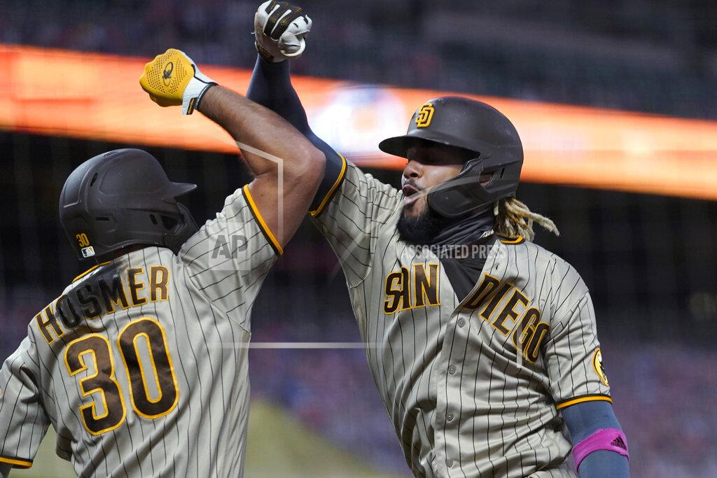 Eric Risberg San Diego Padres' Fernando Tatis Jr., right, is congratulated by Eric Hosmer after hitting a solo home run against the San Francisco Giants during the fourth inning of a baseball game in San Francisco, Saturday, Sept. 26, 2020. (AP Photo/Eric Risberg)