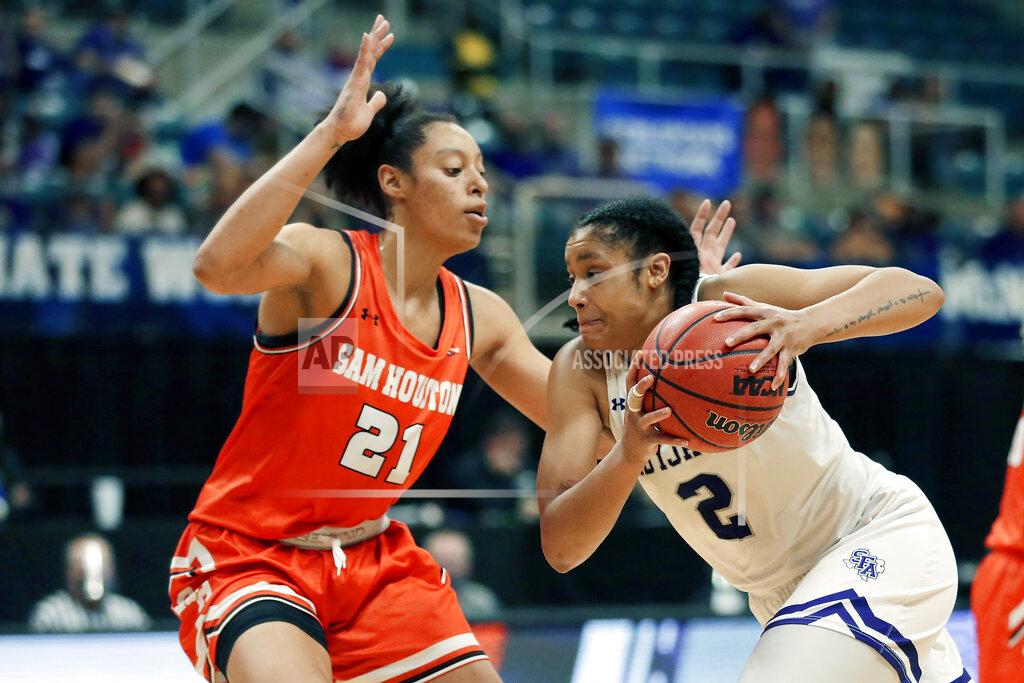 Michael Wyke Stephen F. Austin guard Alyssa Mayfield (2) drives around Sam Houston State forward Madelyn Batista (21) during the first half of an NCAA college basketball game for the Southland Conference women's tournament championship Sunday, March 14, 2021, in Katy, Texas. (AP Photo/Michael Wyke)