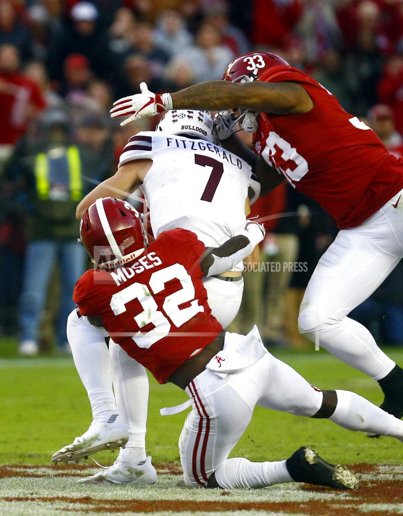 Butch Dill Mississippi State quarterback Nick Fitzgerald (7) is sacked by Alabama linebackers Dylan Moses (32) and Anfernee Jennings (33) during the second half of an NCAA college football game, Saturday, Nov. 10, 2018, in Tuscaloosa, Ala. (AP Photo/Butch Dill)