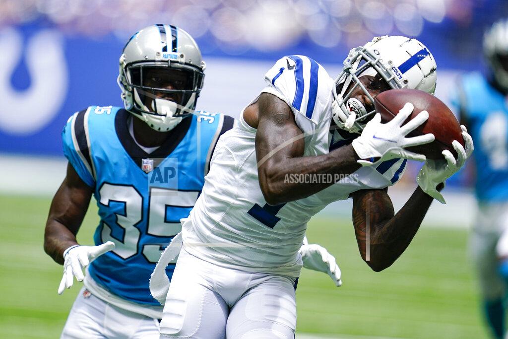 Michael Conroy Indianapolis Colts wide receiver Parris Campbell (1) makes a catch in front of Carolina Panthers corner back Troy Pride Jr. (25) during the first half of an NFL exhibition football game in Indianapolis, Sunday, Aug. 15, 2021. (AP Photo/Michael Conroy)