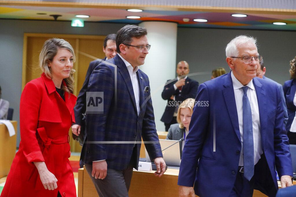 Olivier Matthys Ukraine's foreign minister Dmytro Kuleba, center, Canada's foreign minister Melanie Joly, left, and European Union foreign policy chief Josep Borrell arrive at a meeting of EU foreign ministers at the European Council building in Brussels, Monday, May 16, 2022. European Union foreign ministers on Monday will discuss current affairs and have an exchange of views on the Russian aggression against Ukraine and the Global Gateway. (Stephanie Lecocq/Pool Photo via AP)
