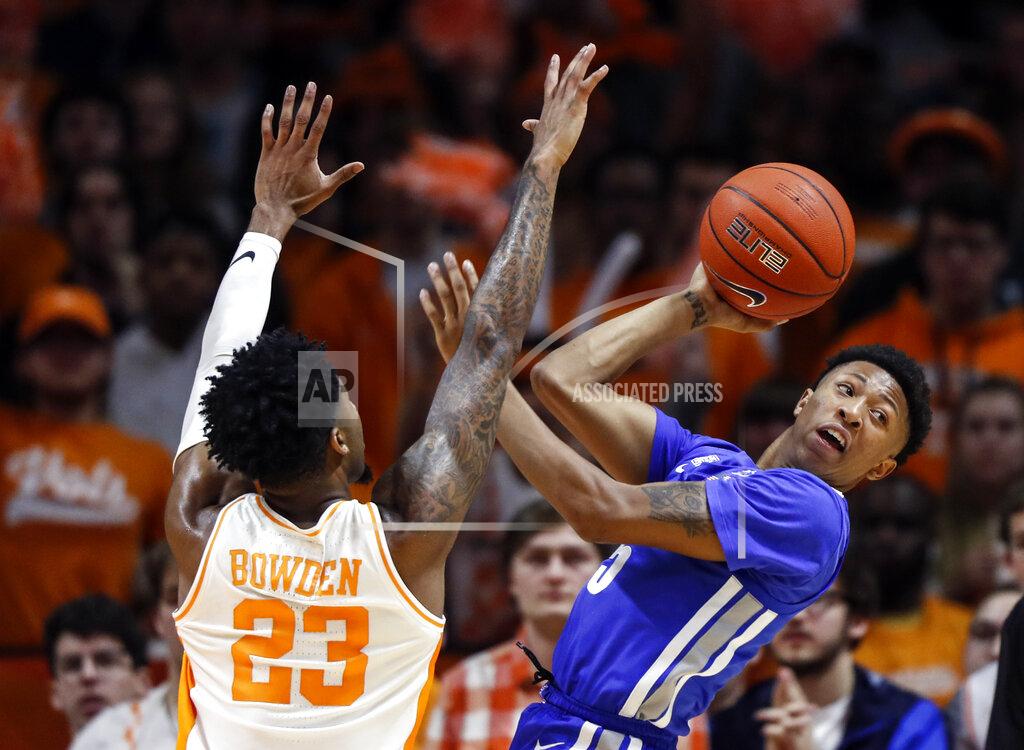 Wade Payne Memphis guard Boogie Ellis (5) passes the ball off as he's defended by Tennessee guard Jordan Bowden (23) during the first half of an NCAA college basketball game Saturday, Dec. 14, 2019, in Knoxville, Tenn. (AP Photo/Wade Payne)