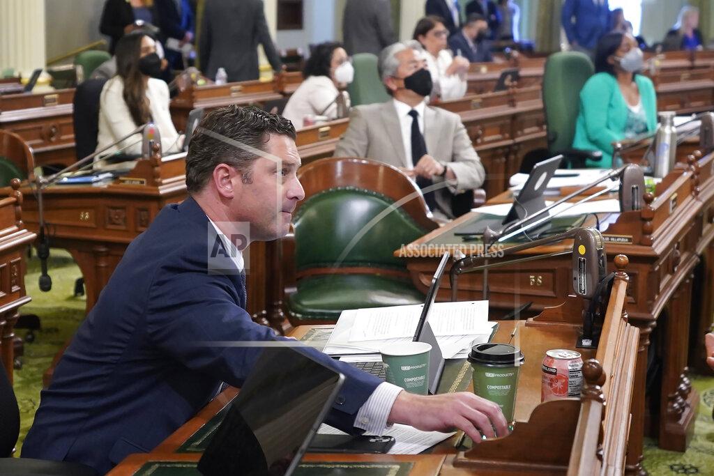 Rich Pedroncelli Assemblyman Jordon Cunningham, R-San Luis Obispo, presses the yes button as he votes for his social media bill during the Assembly session at the Capitol in Sacramento, Calif., on Monday, May 23, 2022. The Assembly approved Cunningham's measure that would hold social media companies responsible for harming children who have become addicted to their products. It would let parents sue platforms like Instagram and TikTok for up to $25,000 per violation. (AP Photo/Rich Pedroncelli)