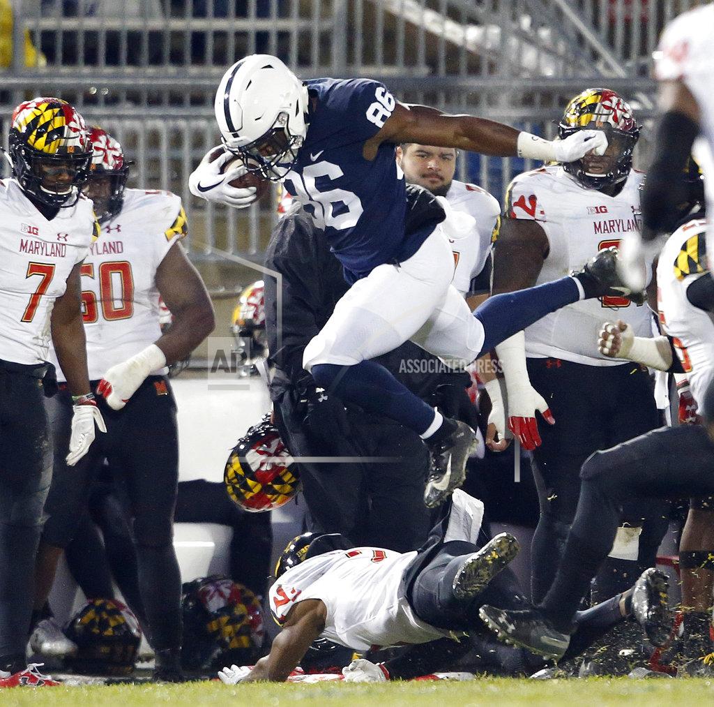 Chris Knight Penn State's Daniel George (86) leaps over Maryland's RaVon Davis (2) after a catch during the first half of an NCAA college football game in State College, Pa., Saturday, Nov. 24, 2018. (AP Photo/Chris Knight)