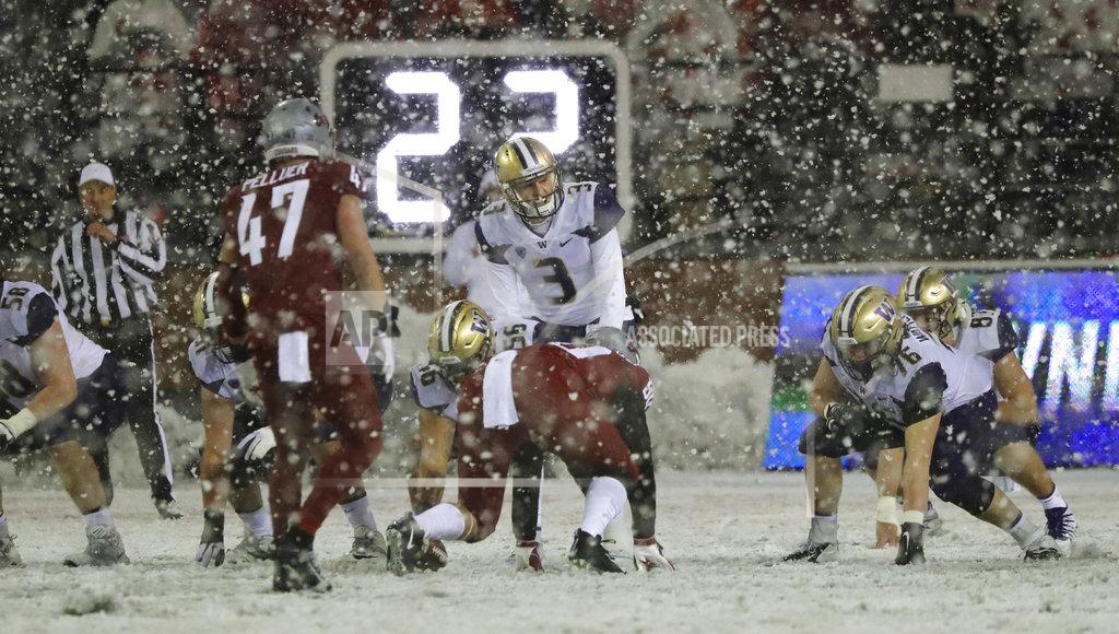 Ted S. Warren Washington quarterback Jake Browning (3) calls for the snap as snow falls at Martin Stadium during the second half of an NCAA college football game against Washington State, Friday, Nov. 23, 2018, in Pullman, Wash. (AP Photo/Ted S. Warren)