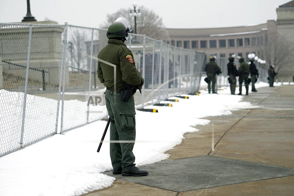 Jim Mone Minnesota Law Enforcement officers protect the Minnesota State Capitol Thursday, Jan. 7, 2021 in St. Paul, Minn., in the wake of the Electoral College protests Wednesday at the U.S. Capitol in Washington, D.C. (AP Photo/Jim Mone)
