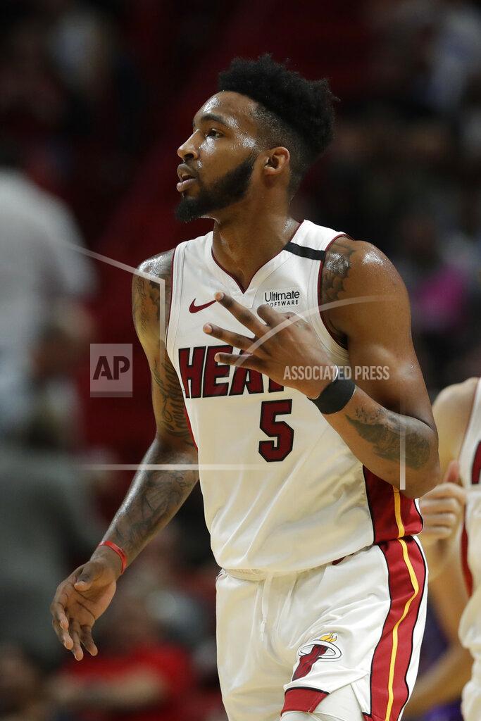 Wilfredo Lee Miami Heat forward Derrick Jones Jr. (5) celebrates a three-point shot during the first half of an NBA basketball game against the Charlotte Hornets, Wednesday, March 11, 2020, in Miami. (AP Photo/Wilfredo Lee)