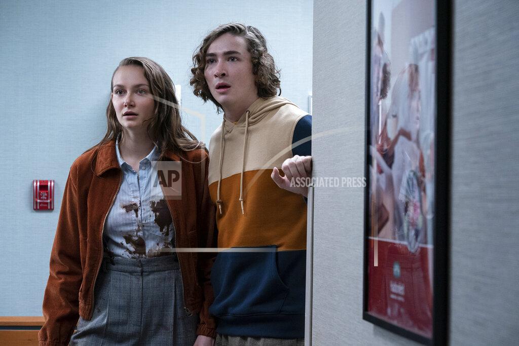 Ryan Green This image released by Universal Pictures shows Andi Matichak, left, and Dylan Arnold in "Halloween Kills," directed by David Gordon Green. (Ryan Green/Universal Pictures via AP)