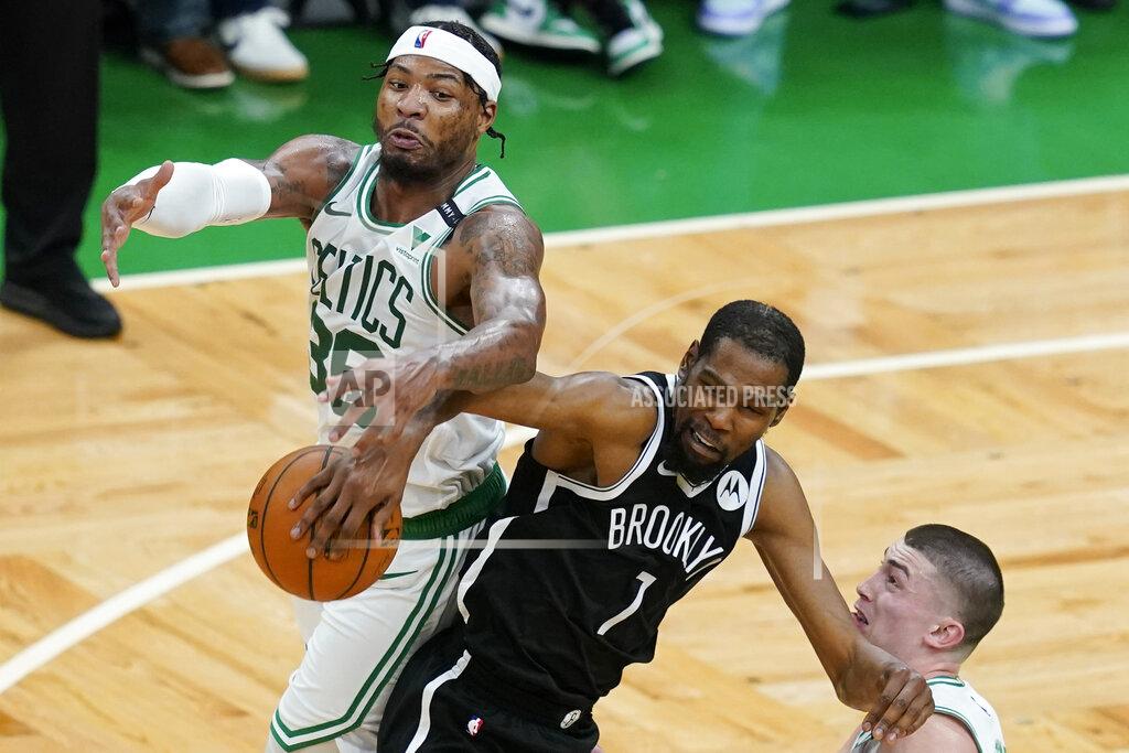 Elise Amendola Boston Celtics guard Marcus Smart (36) and Brooklyn Nets forward Kevin Durant (7) compete for a loose ball in the second half of Game 4 during an NBA basketball first-round playoff series, Sunday, May 30, 2021, in Boston. (AP Photo/Elise Amendola)