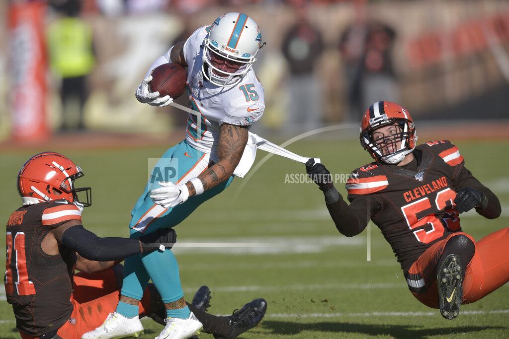 David Richard Miami Dolphins wide receiver Albert Wilson (15) tackled by Cleveland Browns safety Juston Burris (31) and middle linebacker Joe Schobert (53) during the first half of an NFL football game, Sunday, Nov. 24, 2019, in Cleveland. (AP Photo/David Richard)