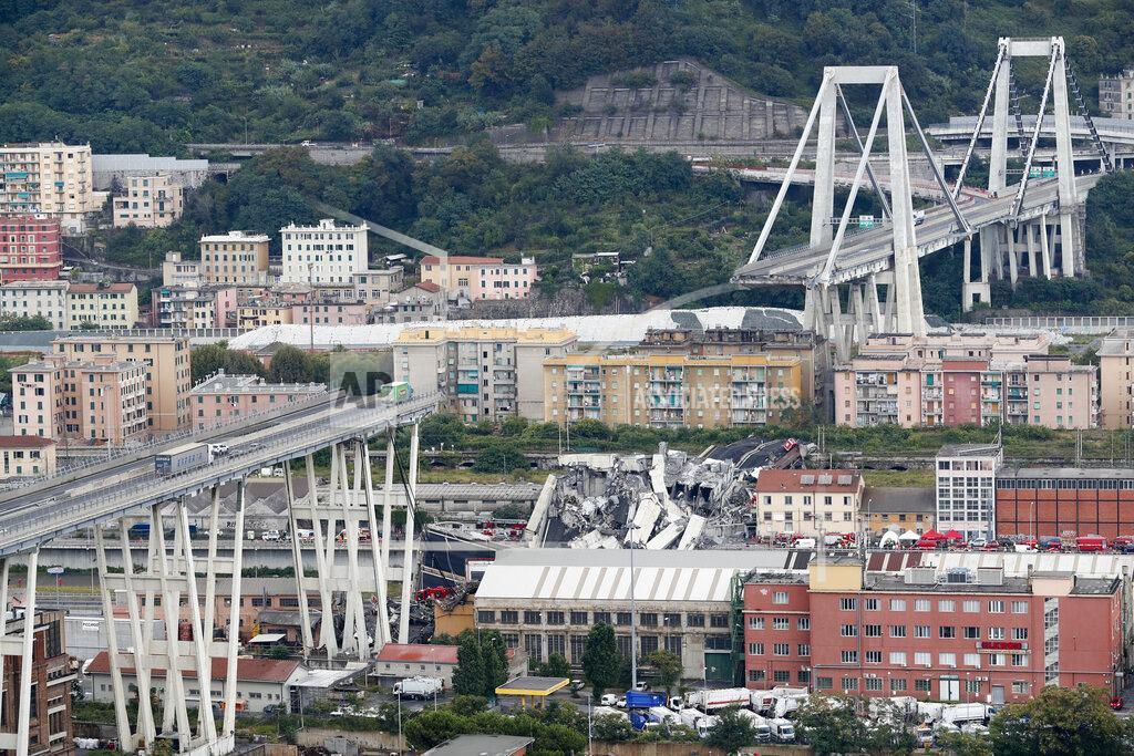 Antonio Calanni FILE - In this Tuesday, Aug. 14, 2018 file photo cars are blocked on the Morandi highway bridge after a section of it collapsed, in Genoa, northern Italy. Fifty-nine people went on trial Thursday, July 7, 2022, for the 2018 collapse of Genoa's Morandi bridge, accused of manslaughter and other charges in the deaths of 43 people. (AP Photo/Antonio Calanni, File)