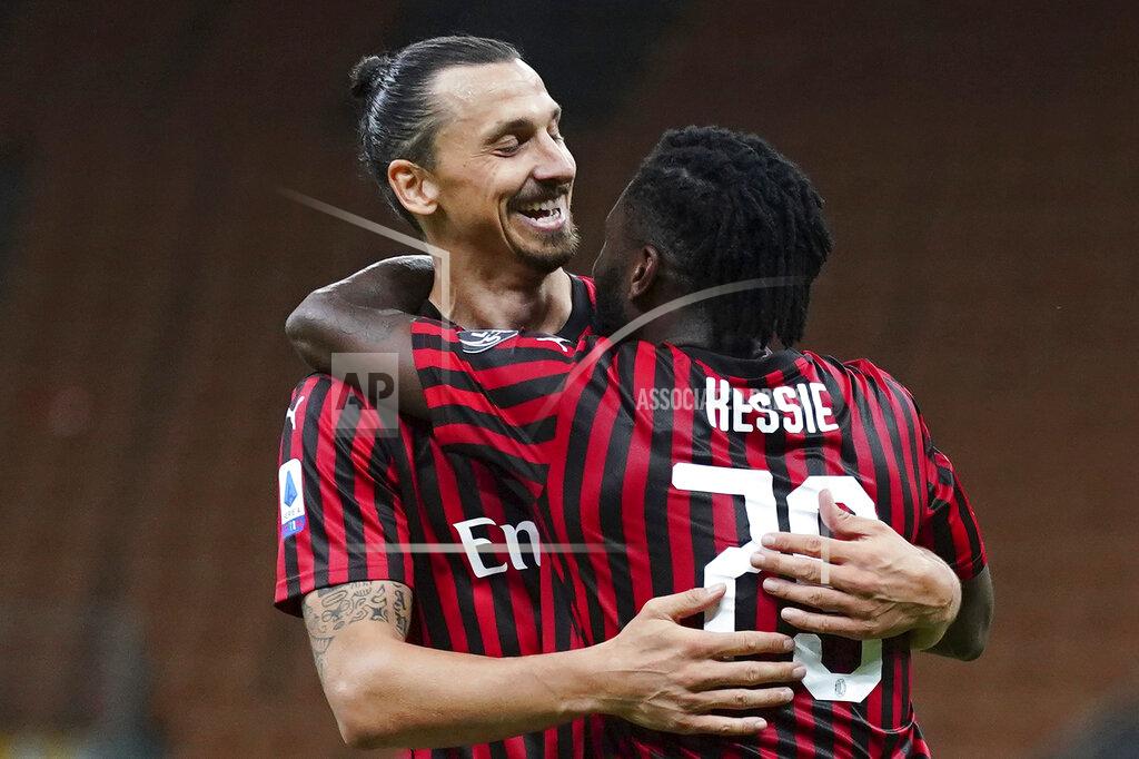Spada AC Milan's Franck Kessie, right, celebrates with Zlatan Ibrahimovic after scoring his side's 2nd goal during the Serie A soccer match between AC Milan and Juventus at the Milan San Siro Stadium, Italy, Tuesday, July 7, 2020. (Spada/LaPresse via AP)