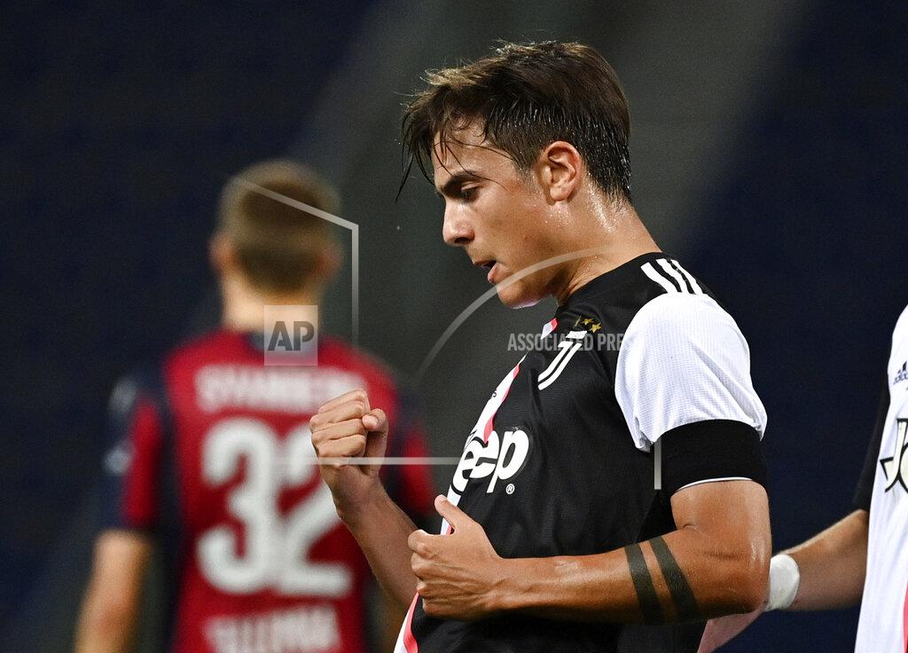 Massimo Paolone Juventus' Paulo Dybala celebrates scoring during the Serie A soccer match between Bologna FC and Juventus FC at Stadio Renato Dall'Ara stadium in Bologna, Monday June 22, 2020. (Massimo Paolone/LaPresse via AP)