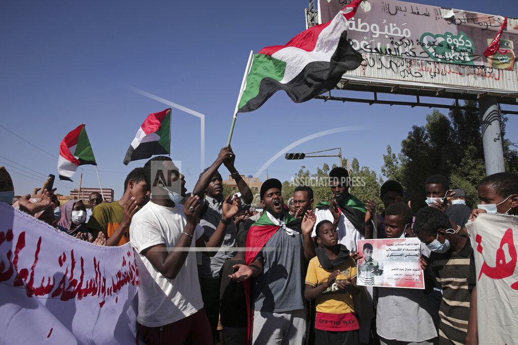 Marwan Ali Thousands of protesters take to the streets to renew their demand for a civilian government in the Sudanese capital Khartoum, Thursday, Nov. 25, 2021. The rallies came just days after the military signed a power-sharing deal with the prime minister, after releasing him from house arrest and reinstating him as head of government. The deal came almost a month after the generals orchestrated a coup. Sudan’s key pro-democracy groups and political parties have dismissed the deal as falling short of their demands for a fully civilian rule. (AP Photo/Marwan Ali)
