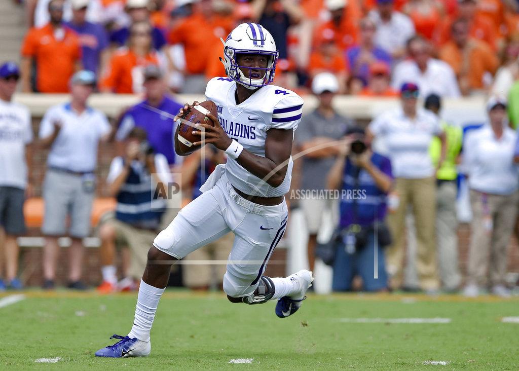 Richard Shiro Furman quarterback Darren Grainger breaks out of the pocket during the first half of an NCAA college football game against Clemson Saturday, Sept. 1, 2018, in Clemson, S.C. (AP Photo/Richard Shiro)