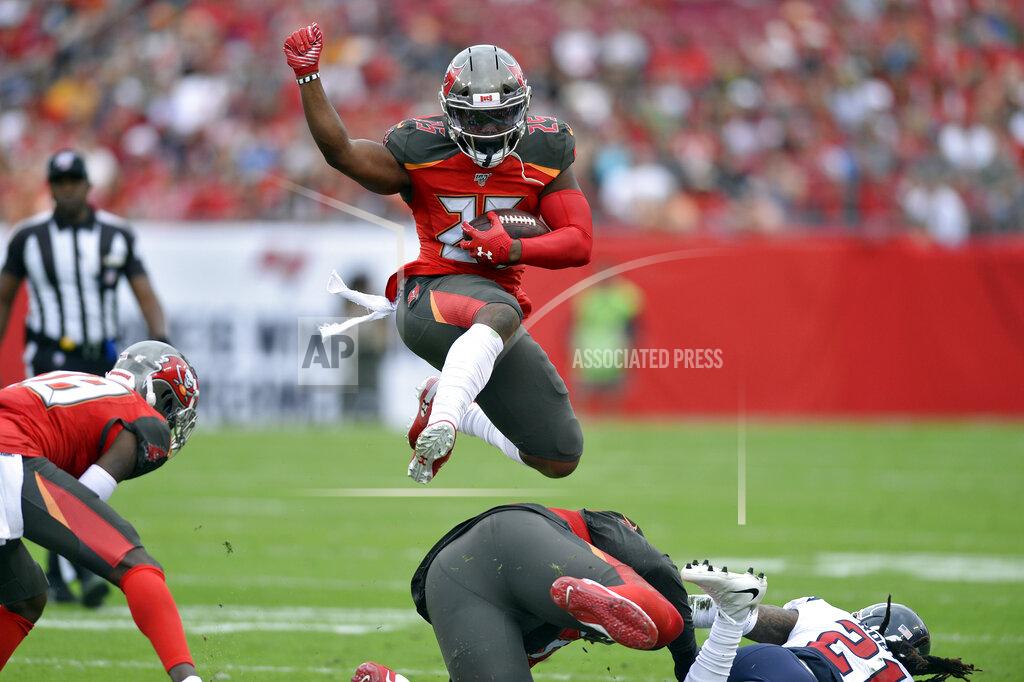 Jason Behnken Tampa Bay Buccaneers running back Peyton Barber (25) hurdles a teammate on a run against the Houston Texans during the first half of an NFL football game Saturday, Dec. 21, 2019, in Tampa, Fla. (AP Photo/Jason Behnken)