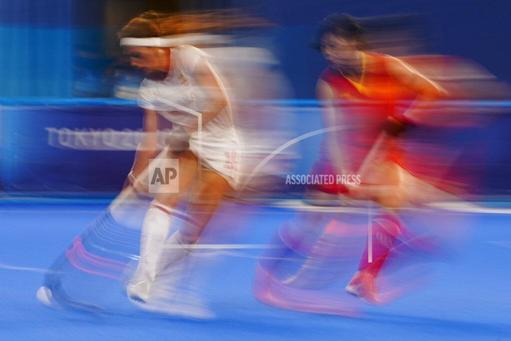 John Minchillo Spain's Begona Garcia Grau, left, drives the ball past China's Jinrong Zhang, right, during a women's field hockey match at the 2020 Summer Olympics, Thursday, July 29, 2021, in Tokyo, Japan. (AP Photo/John Minchillo)