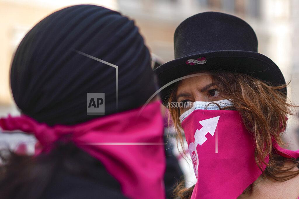 Andrew Medichini Women take part in a demonstration on the International Day for the Elimination of Violence against Women, in Rome, Wednesday, Nov. 25, 2020. (AP Photo/Andrew Medichini)