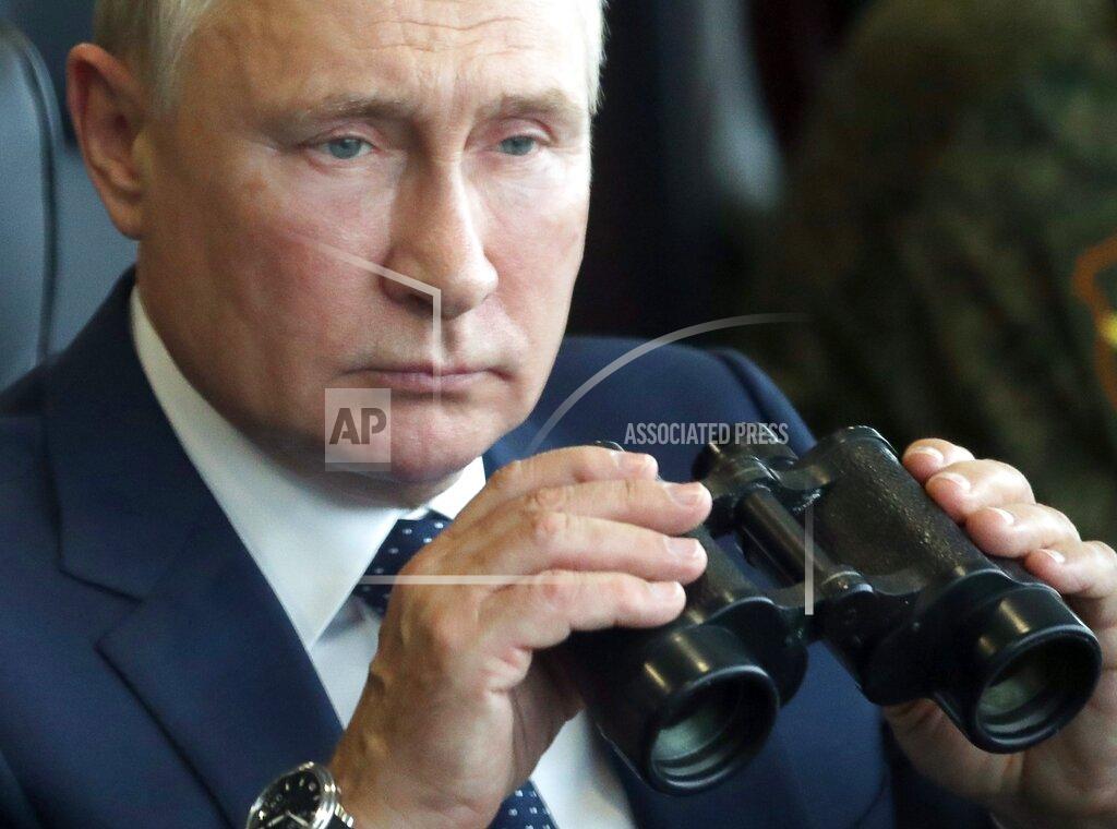Sergei Savostyanov Russian President Vladimir Putin holds a binoculars as he watches the joint strategic exercise of the armed forces of the Russian Federation and the Republic of Belarus Zapad-2021 at the Mulino training ground in the Nizhny Novgorod region, Russia, Monday, Sept. 13, 2021. The military drills attend by servicemen of military units and divisions of the Western Military District, representatives of the leadership headquarters and personnel of military contingents of the armed forces of Armenia, Belarus, India, Kazakhstan, Kyrgyzstan and Mongolia. (Sergei Savostyanov, Sputnik, Kremlin Pool Photo via AP)